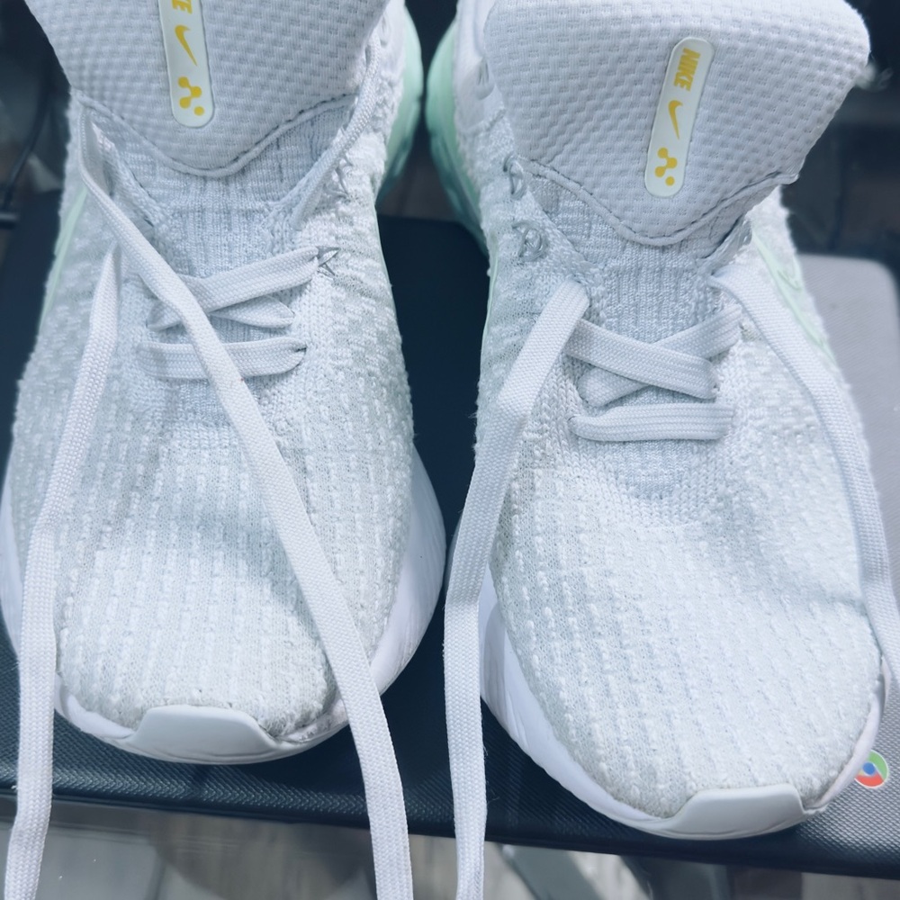 Nike Kids White Sneakers with Pale Yellow Details